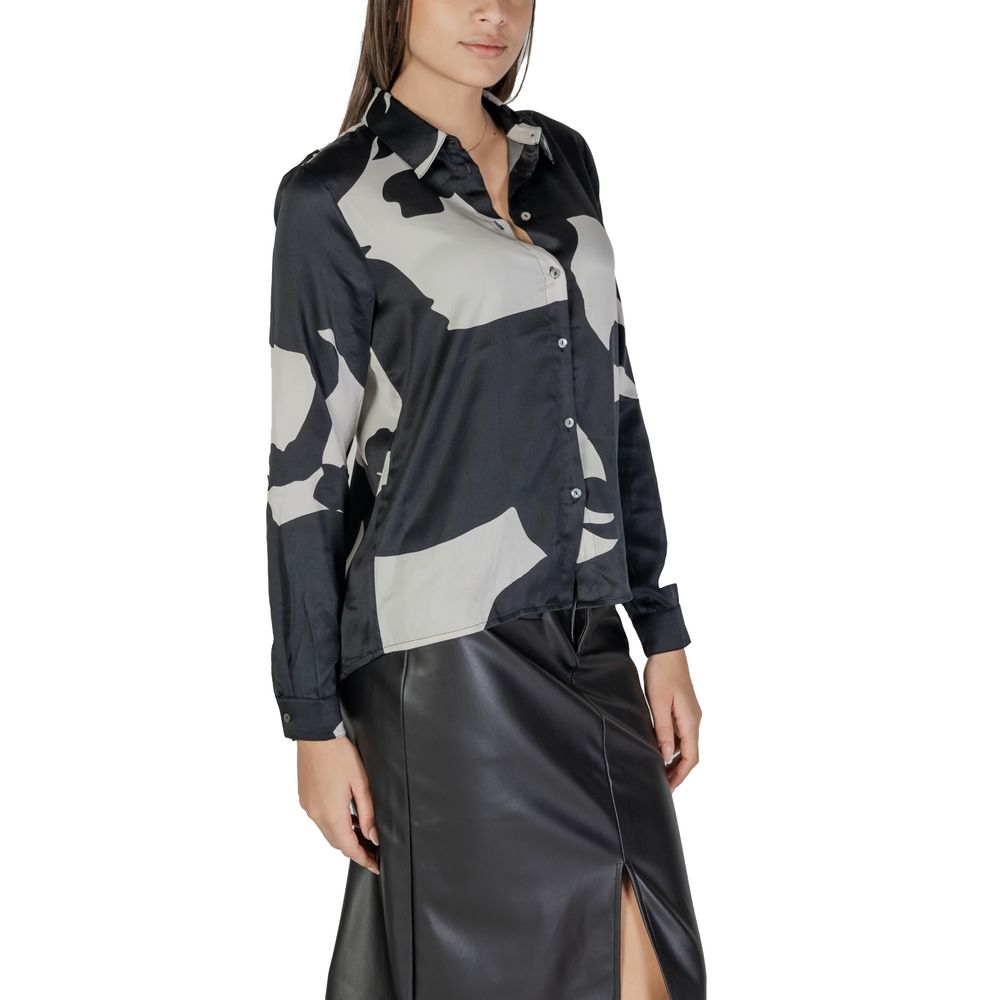 Model wearing Only Black Recycled Polyester Shirt from Fall/Winter collection, women's shirts and blouses, eco-friendly fashion.