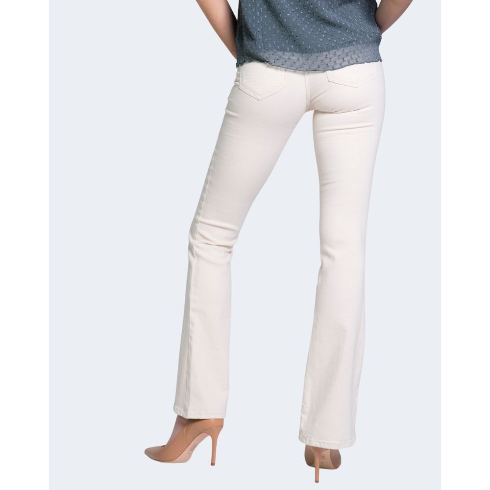 Woman wearing Only Cream Cotton Bootcut Jean showcasing flared design and comfortable fit, perfect for versatile outfits.