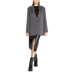 Woman wearing Only Gray Recycled Polyester Blazer, part of women's fall/winter collection, made with eco-friendly materials.