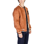Model wearing Only & Sons Brown Polyester Jackets & Coat, showcasing reversible sporty design with embroidered details for versatility.