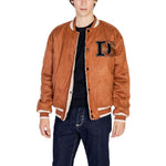 Model wearing Only & Sons Brown Polyester Jackets & Coat, showcasing reversible design and sporty embroidered details, perfect for versatile style.