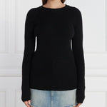 PINKO Black Wool Sweater with crew neck and metal logo detail on back, worn by model in light blue jeans.