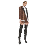 Model wearing PINKO Brown Cotton Women Blazer with python print, tailored peak lapels, and chic button closure, styled with knee-high boots.