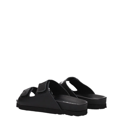 Palm Angels Black Leather Flat Sandals with strap closure and rubber sole, side view showcasing the casual design.
