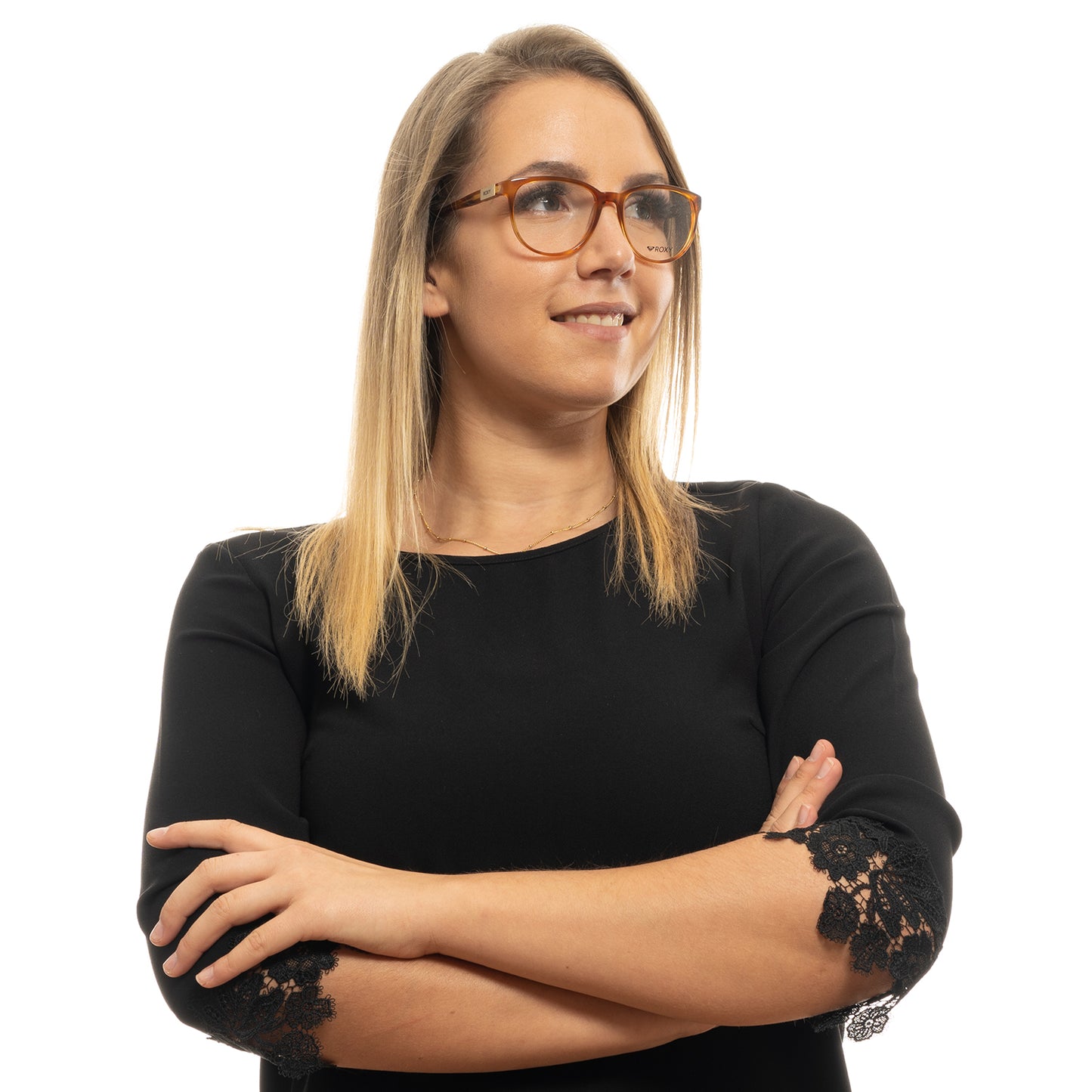 Lady wearing ROXY MOD. ERJEG03031 52ABRN glasses with arms crossed and smiling, dressed in black with lace sleeves.