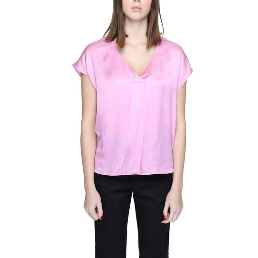 Woman wearing a Rinascimento Multicolor Viscose Blouse, short sleeve, 100% viscose, featuring a vibrant pink hue from the collection.