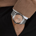Man wearing the SEIKO PRESAGE Mod. CLASSIC wristwatch, featuring a stainless steel band and elegant watch face.