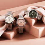 SEIKO PRESAGE Mod. CLASSIC watches displayed on a fabric backdrop, featuring different dial colors and stainless steel bracelets.