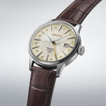 SEIKO PRESAGE Mod. COCKTAIL AUTOMATIC - LEATHER, CREAM watch with brown leather strap and cream dial on display.