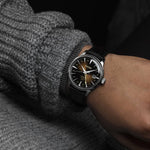 SEIKO PRESAGE Mod. COCKTAIL AUTOMATIC - RUSTY NAIL wristwatch with leather strap on model's wrist, highlighting design and dial.