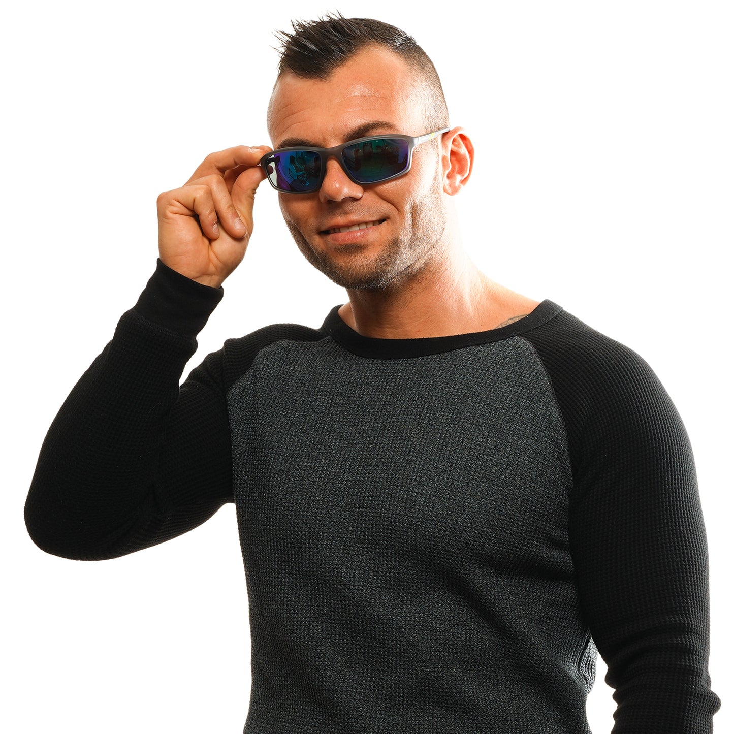 Man wearing SKECHERS MOD. SE6130 6220Q sunglasses, smiling in a black and grey sweater.