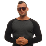 Model wearing SUPERDRY MOD. SDS SUPERSYNTH 14172 sunglasses, showcasing unisex fashion style.