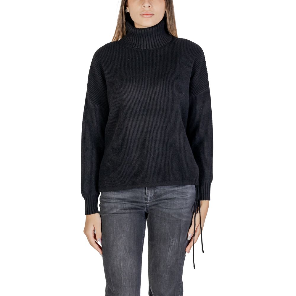 Woman wearing Sandro Ferrone Black Viscose Turtleneck sweater with ribbed design, long sleeves, and regular fit