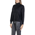 Woman wearing Sandro Ferrone Black Viscose Turtleneck with ribbed knitting and long sleeves.