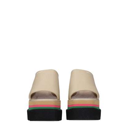 Stella McCartney Beige Leather Slippers with logo detail, eco leather, open toe, wedge heel, casual style, side view.