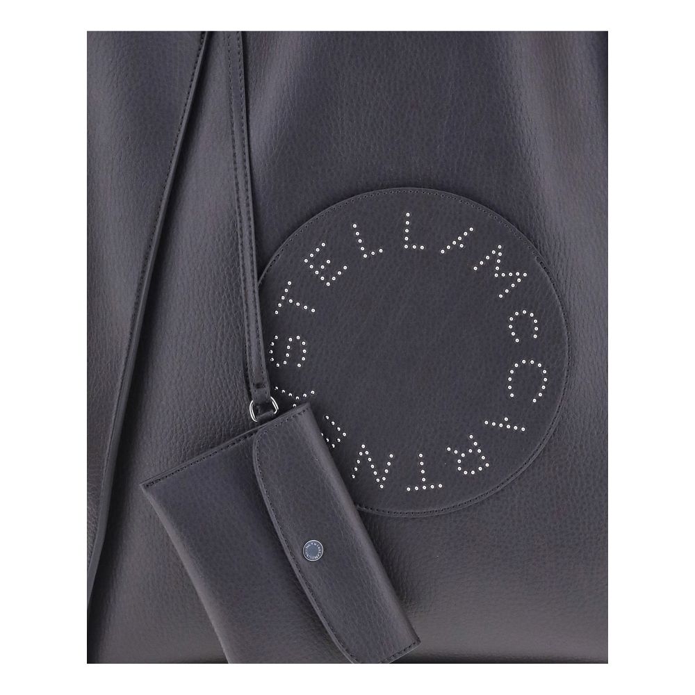 Close-up of Stella McCartney Logo Tote Bag showing iconic studded logo patch and sleek contemporary design.