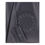 Close-up of Stella McCartney Logo Tote Bag showing iconic studded logo patch and sleek contemporary design.