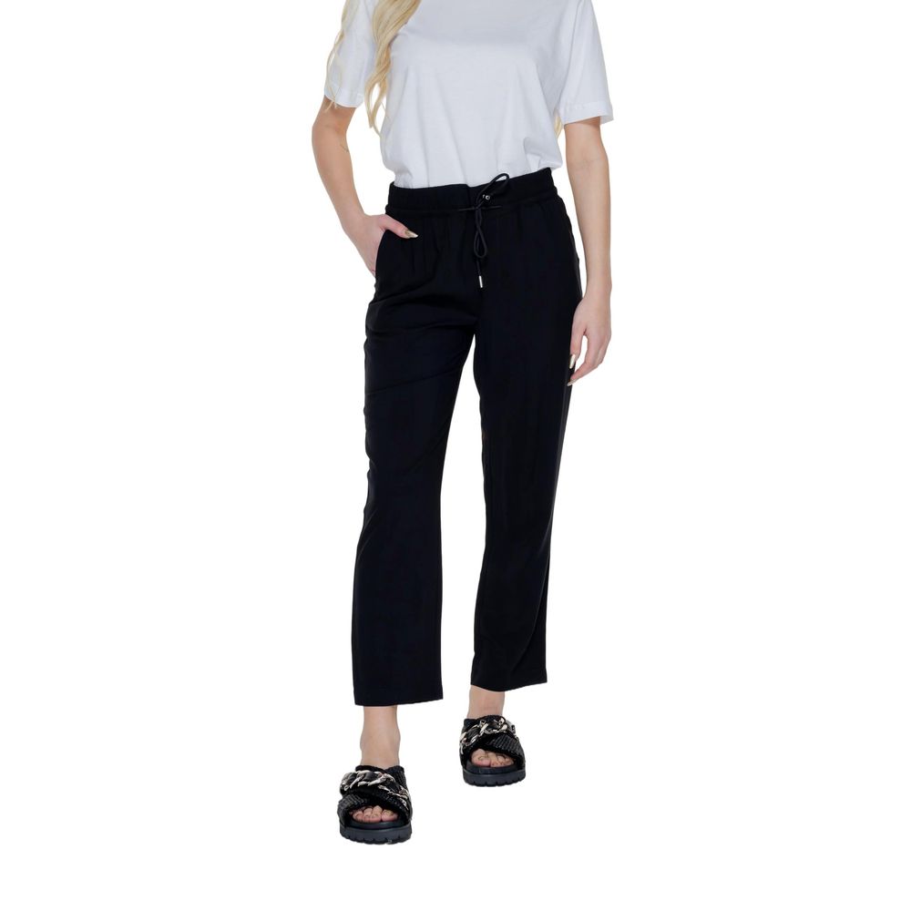 Woman wearing Street One Black Viscose Pant, featuring a slim cigarette cut and ankle length.