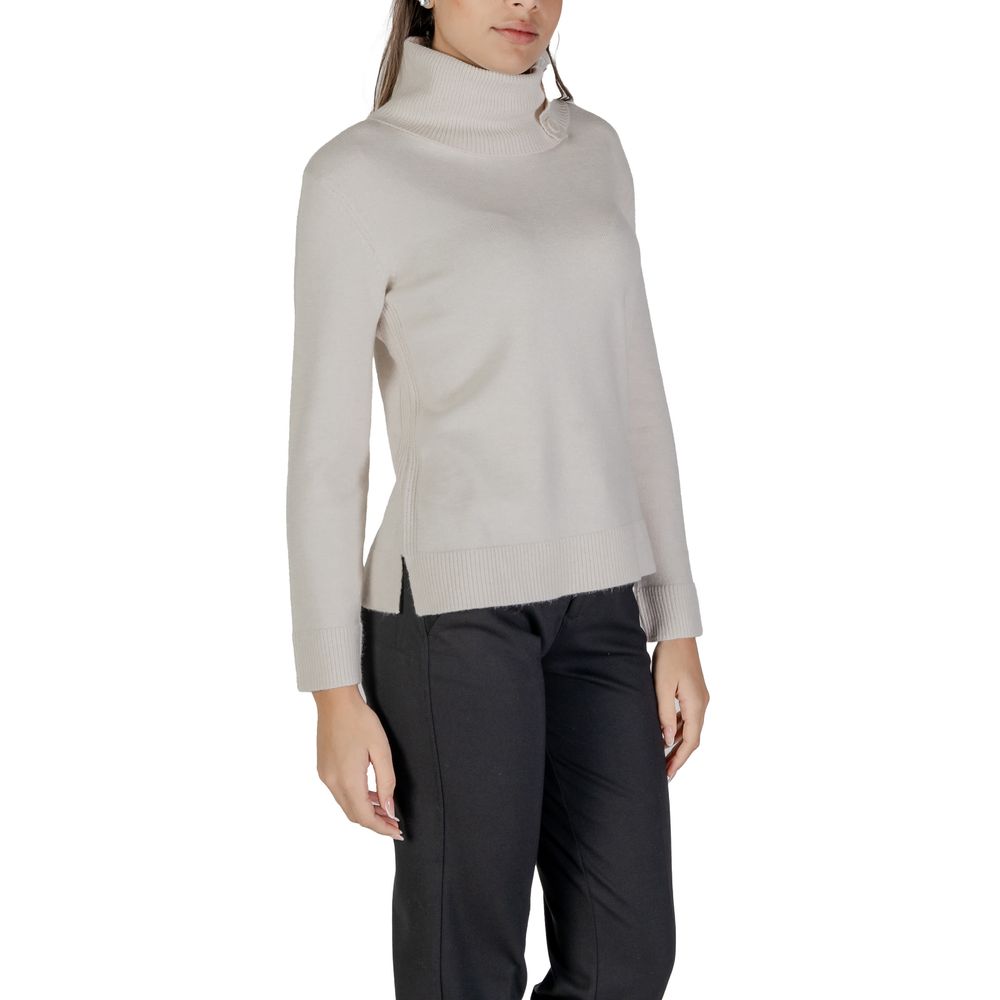 Woman wearing a Street One Cream Viscose Turtleneck with side buttons and long sleeves, showcasing stylish and versatile knitwear.