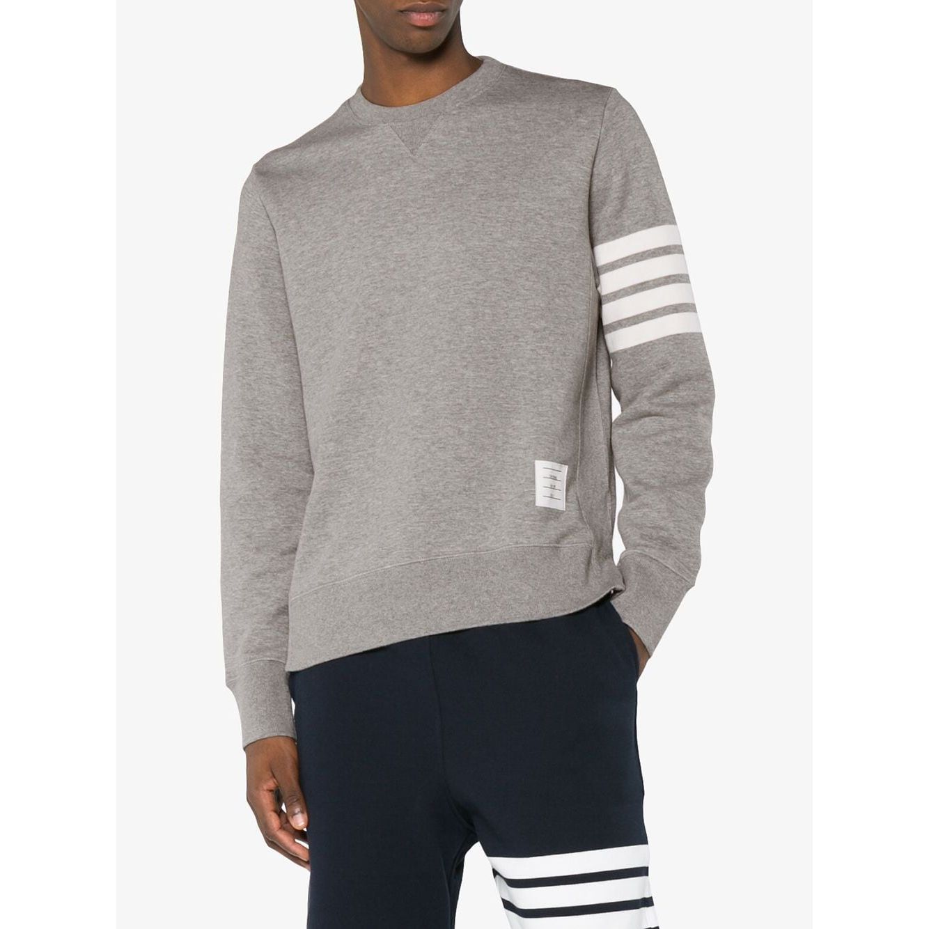 Thom Browne Sweaters Light Grey with 4-Bar stripe and button side fastening, model wearing relaxed fit