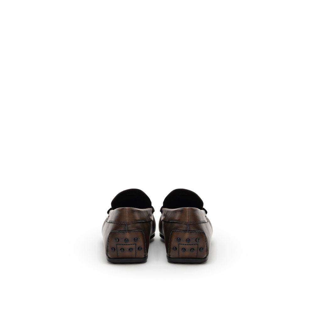 Rear view of Tod's Brown Leather Moccasin with Gommino sole and metal decoration, showcasing Italian craftsmanship.