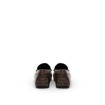 Rear view of Tod's Brown Leather Moccasin with Gommino sole and metal decoration, showcasing Italian craftsmanship.