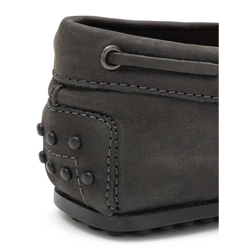 Close-up of Tod's Gray Nubuc Leather Moccassin heel with Gommino sole, showcasing elegant design and Italian craftsmanship.