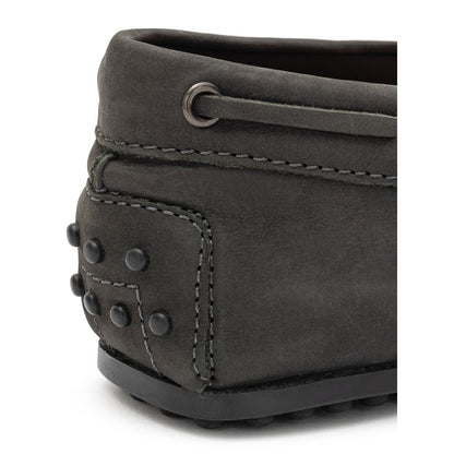 Close-up of Tod's Gray Nubuc Leather Moccassin heel with Gommino sole, showcasing elegant design and Italian craftsmanship.