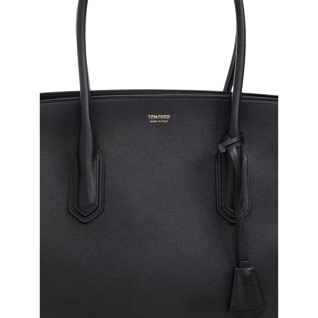 Tom Ford Structured Tote Bag in black with dual top handles and logo plaque, featuring a smooth finish and elongated shape.