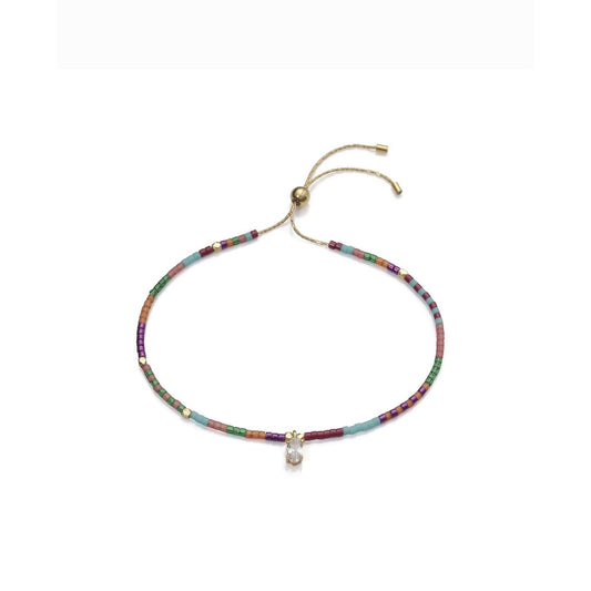 Colorful bead bracelet with adjustable string and charm, elegant jewelry accessory.