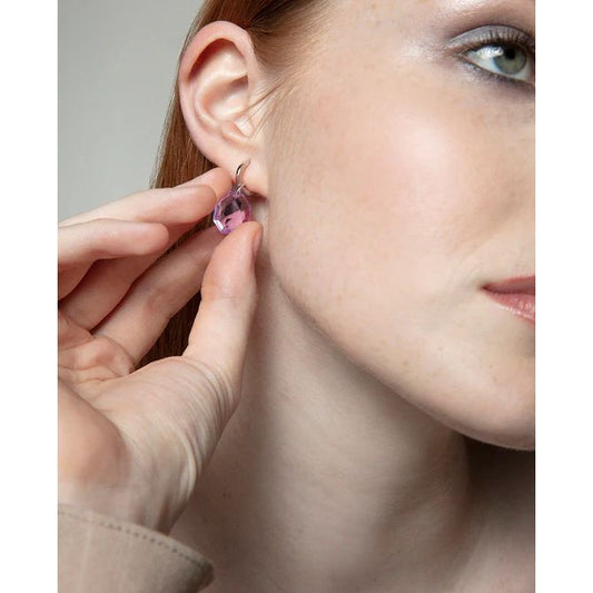 Woman wearing VICEROY JEWELS Mod. 13229E100-57 silver 925° earrings with quartz pink gemstone, close-up view on ear.