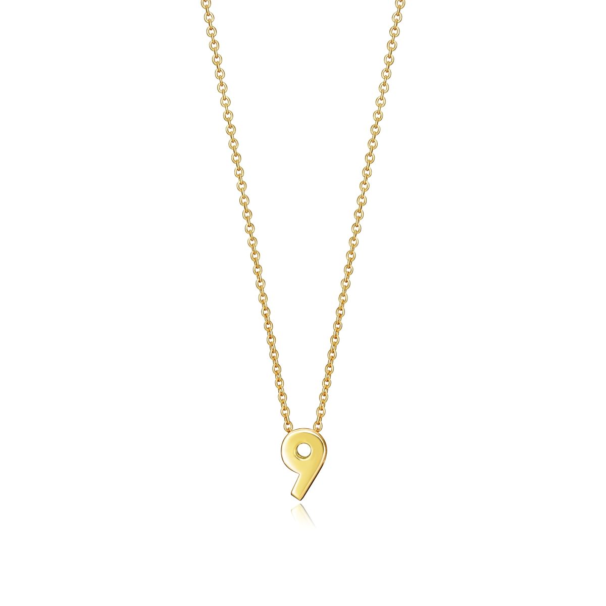 Gold necklace with a pendant in the shape of the number 9, displayed on a white background, showcasing elegant jewelry design.