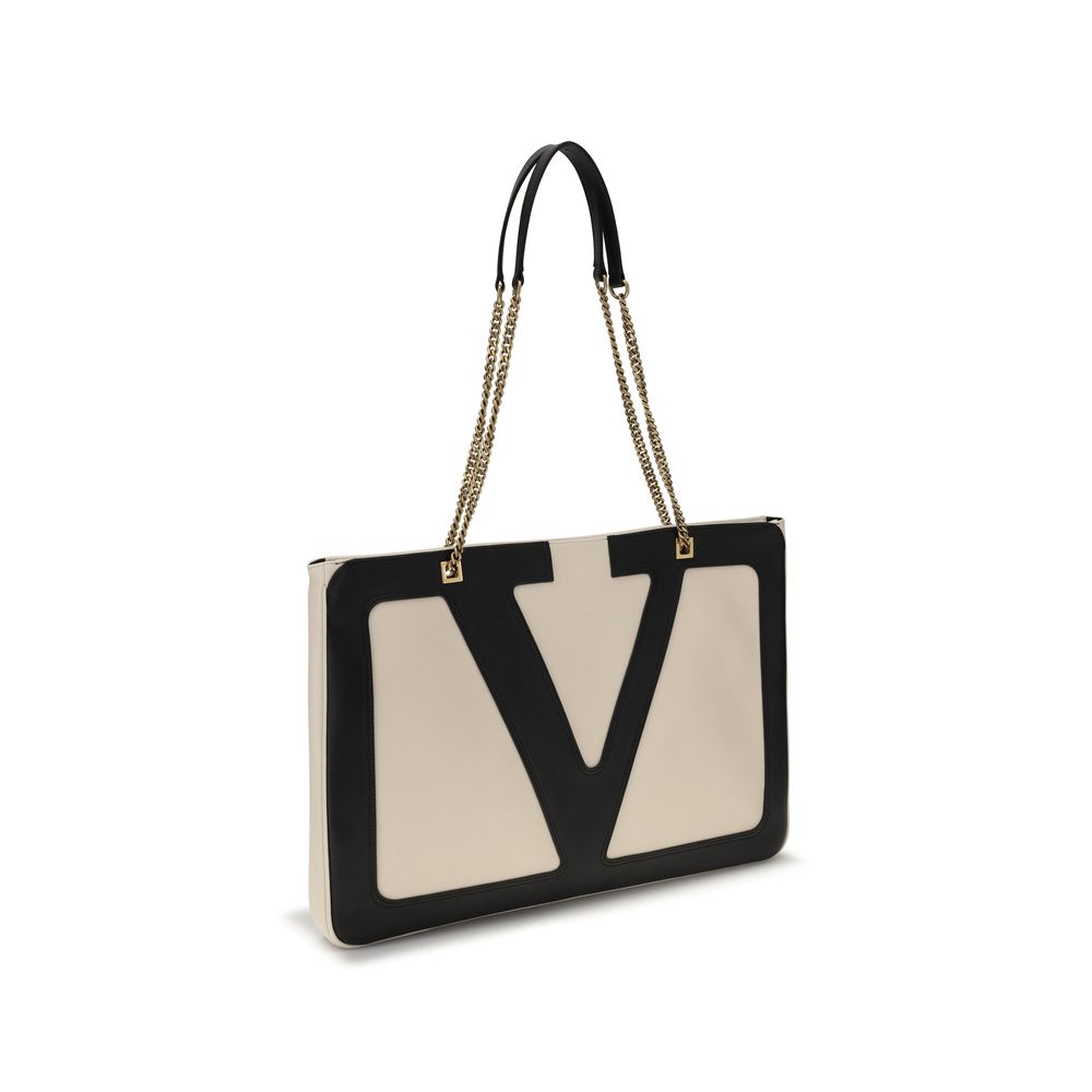 Valentino Garavani Cream Lamb Ovis Aries Aries Shoulder Bag with maxi VLogo and sliding chain on white background.