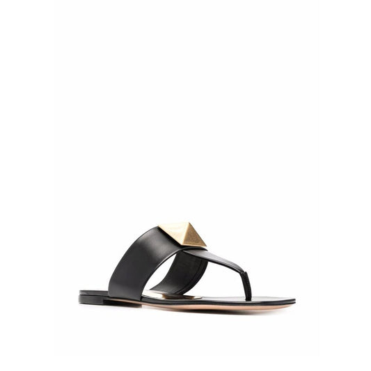 Valentino Garavani One Stud sandals in black leather with a round toe and thong strap, featuring a signature stud detail.