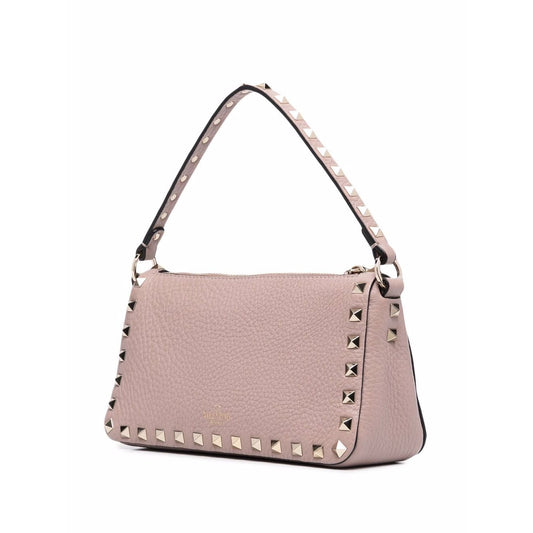Valentino Garavani Rockstud small leather shoulder bag in powder pink with pebbled texture and signature Rockstud embellishments.