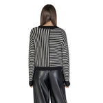 Back view of Vero Moda Black And White Recycled Polyester Sweater showcasing striped knit design for women in fall/winter collection.