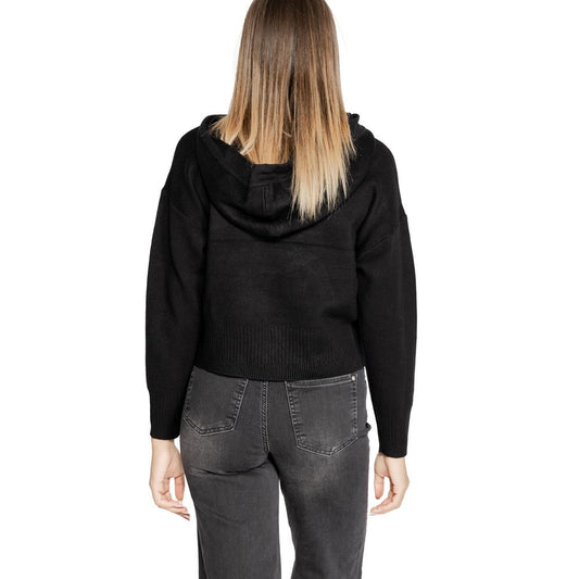 Back view of model wearing Vero Moda Black Viscose Sportswear hooded sweater with a relaxed fit.