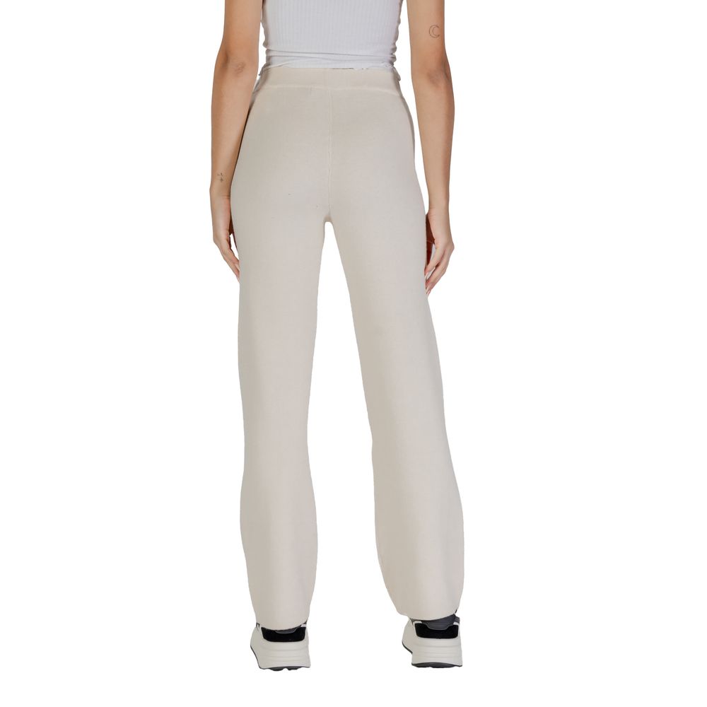 Back view of woman wearing Vero Moda Cream Viscose Pant showcasing the elegant wide-leg palazzo style.