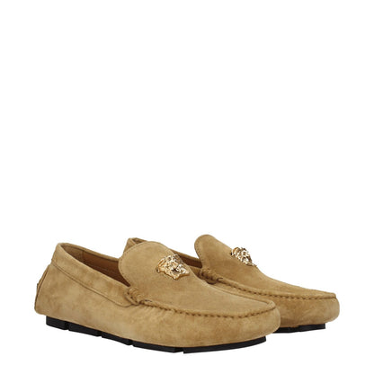 Versace Beige Leather Slip-On Loafers with gold logo, suede exterior, low flat heel, and round toe design, casual footwear.