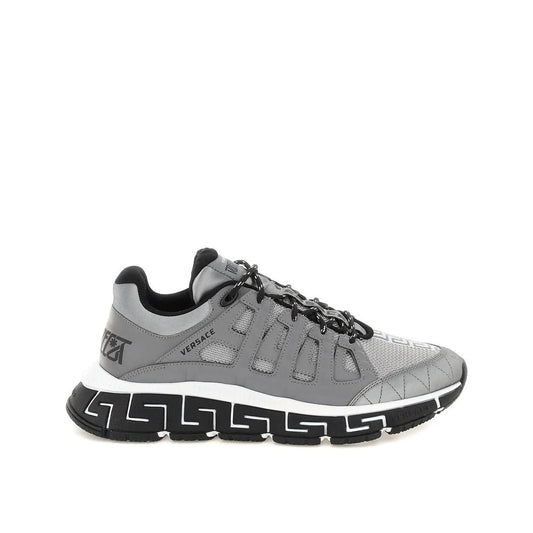 Versace Trigreca Sneaker with leather details, rubber sole, and front and back logo detail, made in Italy.