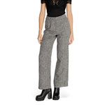 Woman wearing Vila Clothes Black Recycled Polyester Pant with wide leg and high waist tailored fit, enhancing contemporary style.