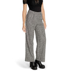 Woman wearing Vila Clothes Black Recycled Polyester Pant with wide leg tailored design, high waist fit, and elegant style.