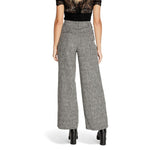 Back view of model wearing Vila Clothes Black Recycled Polyester Pant with wide leg tailored fit for women.