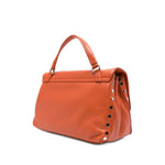 Zanellato Postina Daily Small leather handbag in orange with twist-lock fastening, single top handle, and stud detailing.
