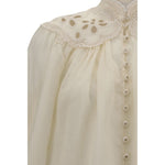 Close-up of Zimmermann Embroidered Coco Blouse showcasing lace inserts and covered buttons.