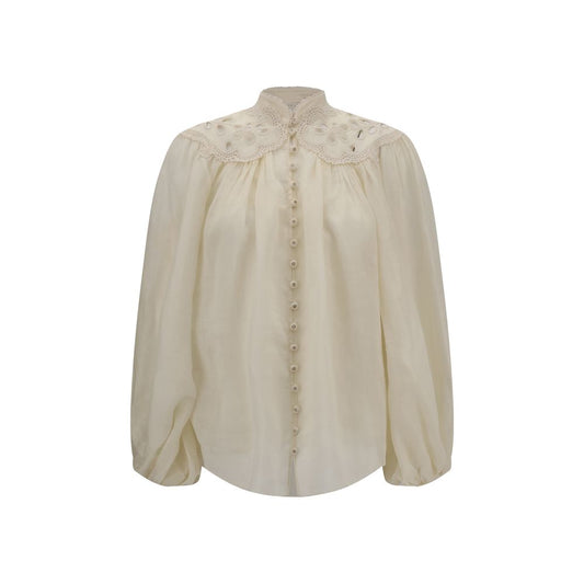 Zimmermann Embroidered Coco Blouse featuring puff sleeves and lace details.