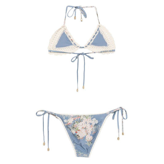 Zimmermann Floral print bikini set in light blue, featuring crochet details, halterneck tie top, and side-tie bottoms.