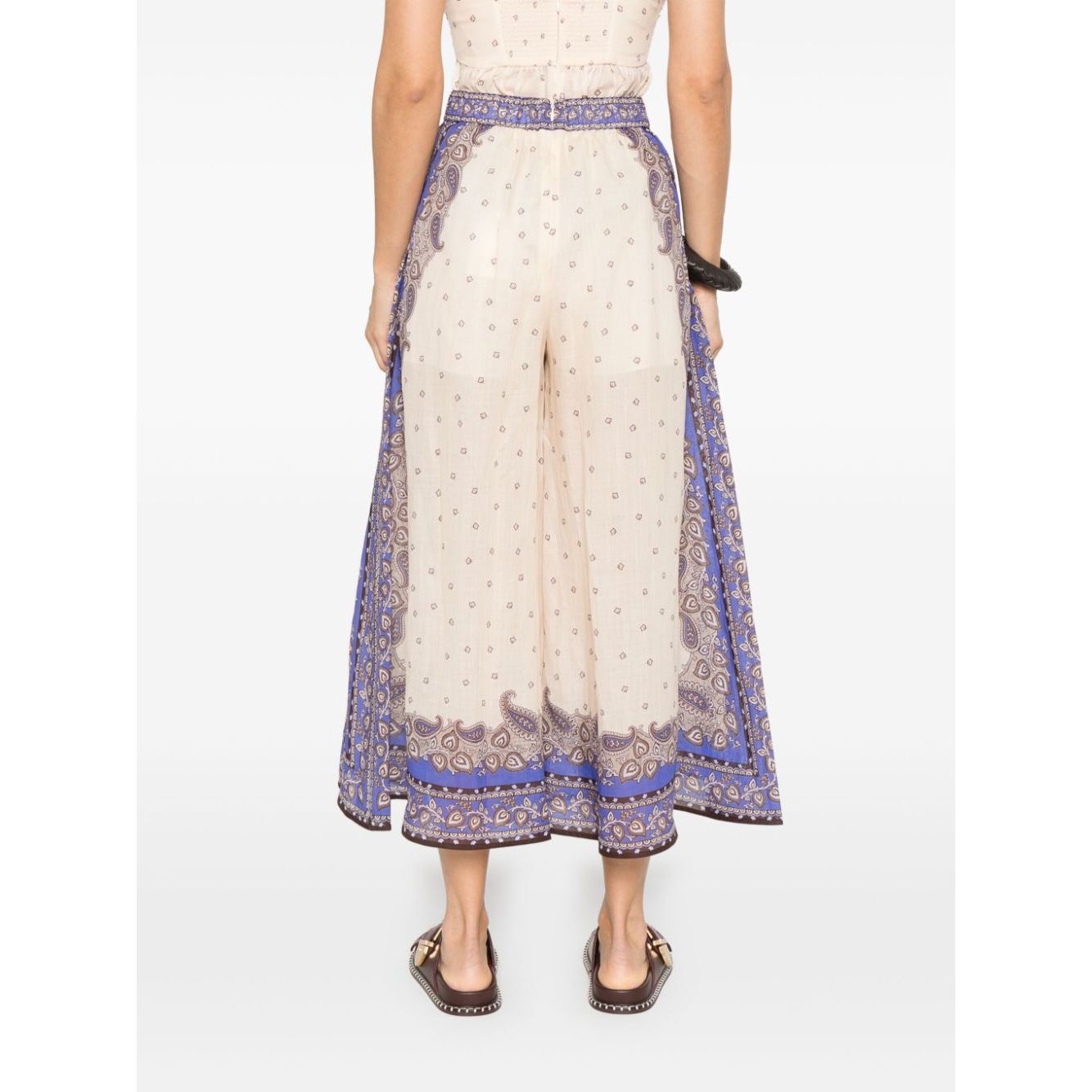 Back view of Zimmermann Maxine trousers in ecru with side slit pockets and eco-friendly materials
